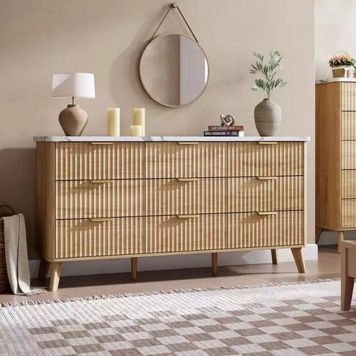 A nine-drawer chest of drawers in the bedroom; with gold handles.
